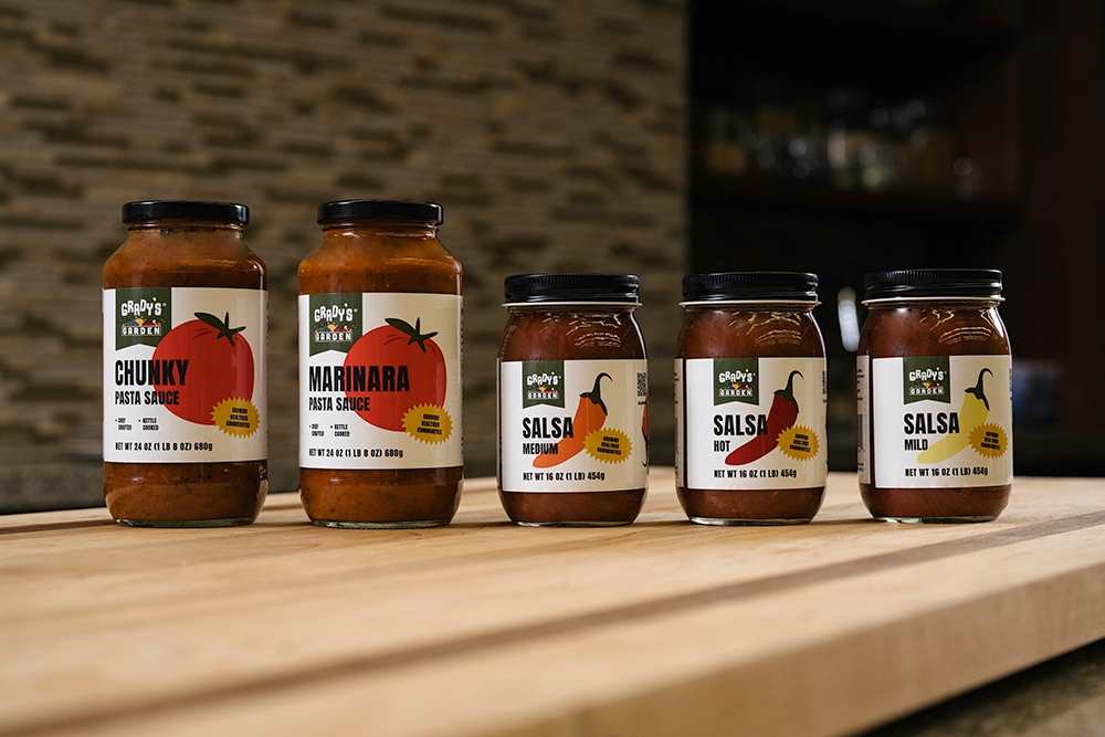 Grady's Garden chunky pasta sauce jar surrounded by vegetables